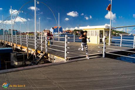 Run, run, run before getting locked on the bridge. She just makes it. The others had to wait.