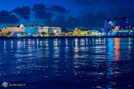 Lights reflect upon the bay in Willemstad as night takes over.