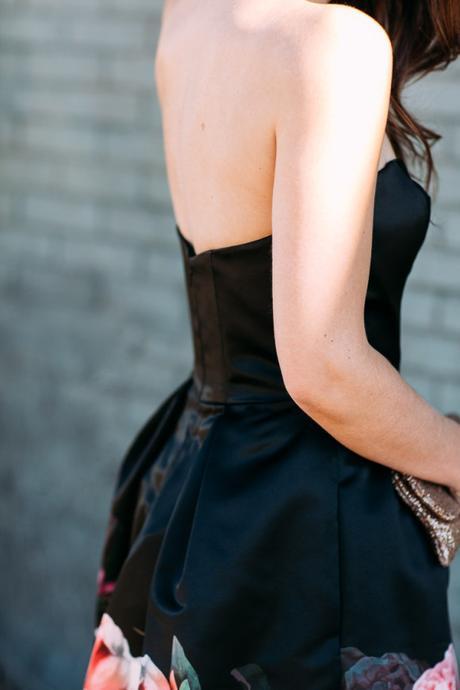 Amy Havins wears a black party dress from the David's Bridal holiday 2015 collection.