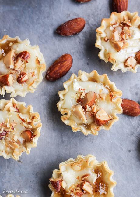 These Easy Brie Bites have only four ingredients, but make a delicious appetizer that you won't be able to get enough of! Gooey brie and crunchy smokehouse almonds make this simple appetizer recipe shine. 