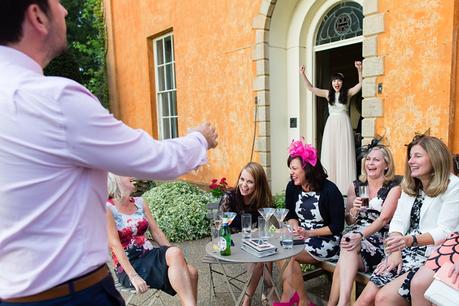 Coupel cheering at each other Bride & groom under willow tree Langar Hall Wedding Photography