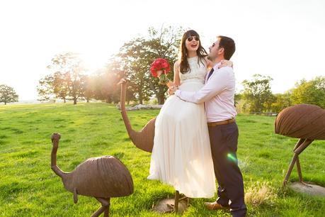 bride & groom pose on emus at Langar Hall Wedding