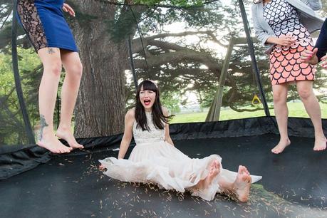 Bride laughing on trampoline