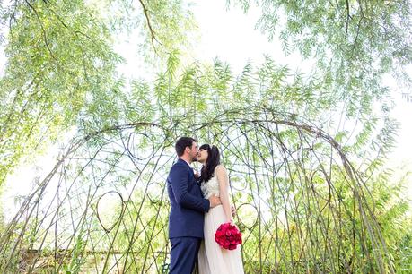 Bride & groom under willow tree arbour Langar Hall Wedding Photography