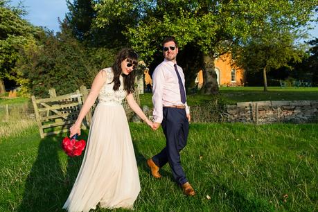Bride and groom portraits with low summer sun Bride & groom under willow tree Langar Hall Wedding Photography wearing sunglasses