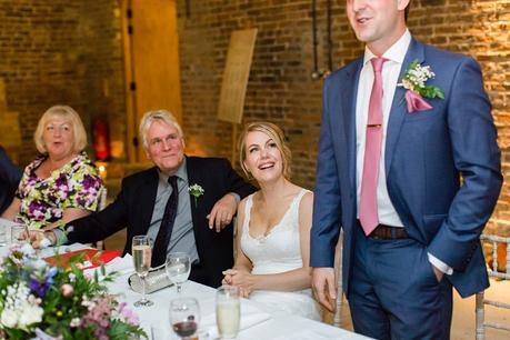 Bride looking at groom during speeches