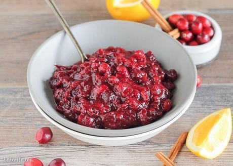 This Paleo Cranberry Sauce is sweetened with maple syrup to keep it refined sugar free. Orange zest and warm spices give this cranberry sauce incredible flavor, and it's done in 15 minutes.