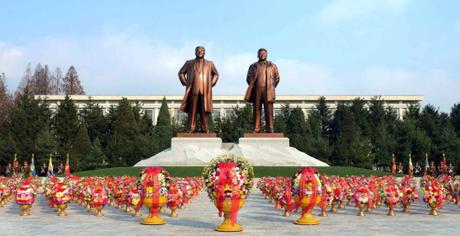 Statues of Kim Il Sung and Kim Jong Il at the center of the campus of the Kim Il Sung University of Politics in Pyongyang. A floral basket from Kim Jong Un can be seen in the foreground, center (Photo: Rodong Sinmun).