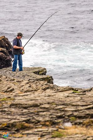 Irish fishing at the cliffs on Loop Head Drive