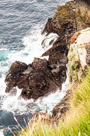 Waves crash at Irish cliffs