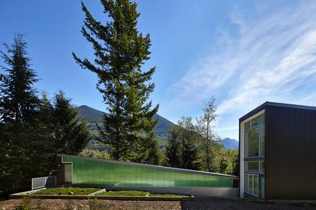 Green polycarbonate exterior of modern Seattle cabin by David Coleman.