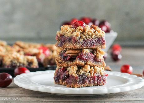 These Paleo Cranberry Crumb Bars use leftover cranberry sauce to make an irresistible gluten-free, refined sugar-free, and vegan dessert. The crumb mixture doubles as the crust and crumb topping.