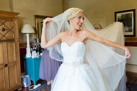 Bride gets into wedding dress at Crow Hill Wedding Tux & Tales Photography