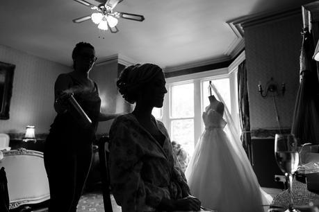 Dark photograph of bride getting ready at Crow Hill Wedding