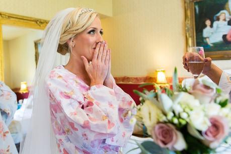Bride smiles and covers her face at Crow Hill Wedding