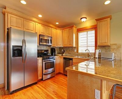 Kitchen with hardwood floor and granite.