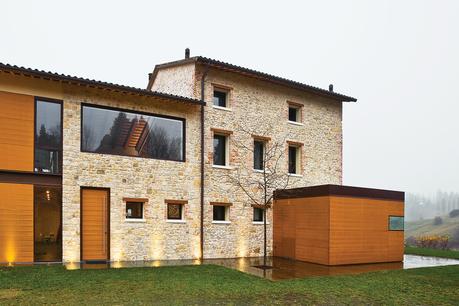 sandstone and teak facade of remodeled Italian house