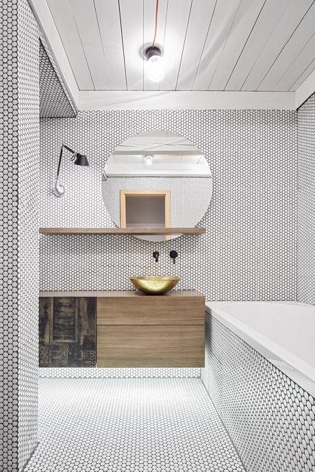 Tolomeo Micro Parete lamp from Artemide and brass washbasin from Morocco in Prague bathroom renovation.
