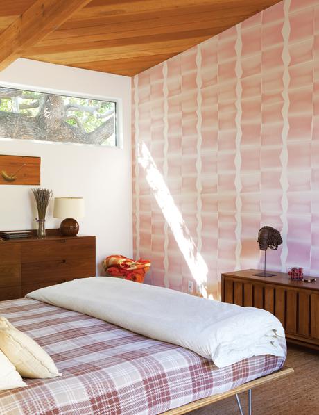 Modern master bedroom with Modernica bed and printed wallpaper 