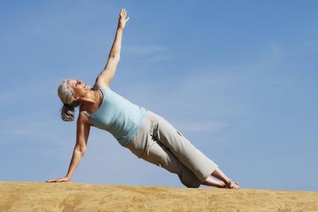 Middle Aged Woman Practicing Yoga