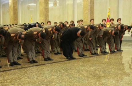 Kim Jong Un and members of the KPA high command bow in front of statues of his father and grandfather in Pyongyang on December 17, 2015 (Photo: Rodong Sinmun).