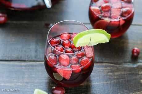 This Cranberry Lime Sangria is a sparkling + festive take on sangria! This is the perfect refreshing cocktail for a crowd.