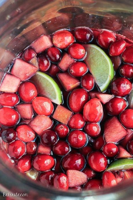 This Cranberry Lime Sangria is a sparkling + festive take on sangria! This is the perfect refreshing cocktail for a crowd.