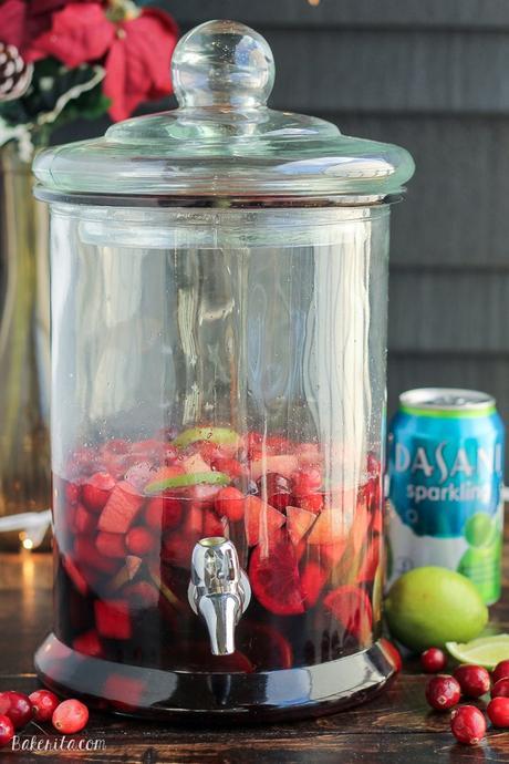 This Cranberry Lime Sangria is a sparkling + festive take on sangria! This is the perfect refreshing cocktail for a crowd.