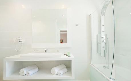 The Kassandra Bay Hotel Executive Junior Suites bathroom all white all-white design modern traditional classic style theme tips ideas advice how to interior designer professional expert luxury ultra floating vanity open shelf glass enclosed shower open mirror integrated sink faucet