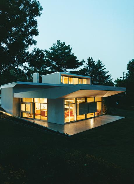 Terry removed the entire second floor, which featured a gabled roof and two diminutive bedrooms, and replaced it with an aluminum-trimmed box covered in cement fiberboard.