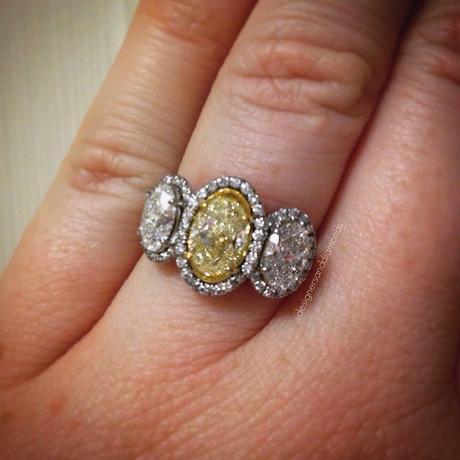 Fancy yellow oval halo engagement ring