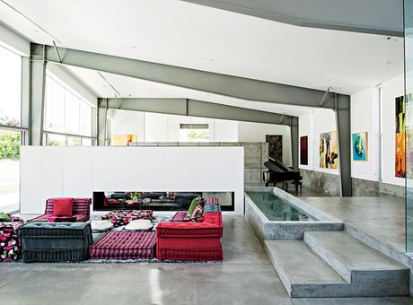 Desert Canopy House living room with Mah Jong sofa by Roche Bobois and water feature