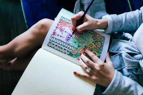 Amy Havins of Dallas Wardrobe cozies up with her adult coloring book to destress.
