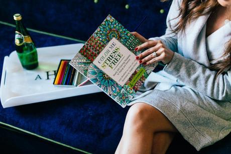 Amy Havins of Dallas Wardrobe cozies up with her adult coloring book to destress.