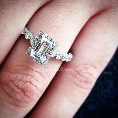Simon G emerald cut halo engagement ring with diamond band