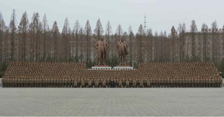 Kim Jong Un poses for a commemorative photo with senior officers of the Ministry of the People's Armed Forces, KPA General Staff and KPA General Political Department, in front of the statues of his father and grandfather at the MPAF complex (Photo: Rodong Sinmun/KCNA).