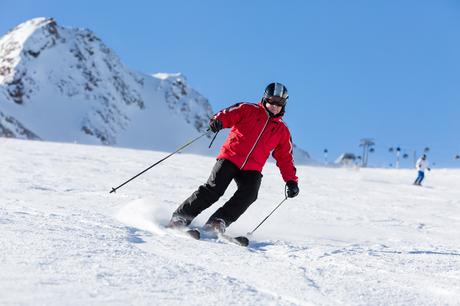 bigstock-Skier-Skiing-On-Ski-Slope-83913128
