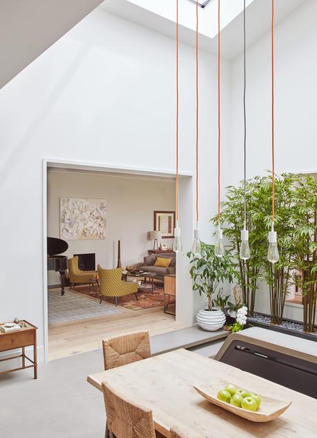 SoCo pendant lights by Tech Lighting in atrium of Chicago renovation by dSPACE Studio.