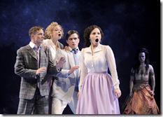 Hermia (Christina Nieves, right) is outraged by the insults launched at her by (l-r) Demetrius (Matt Schwader), Helena (Laura Huizenga) and Lysander (Andrew Truschinski), while Oberon (Timothy Edward Kane) observes the chaos his magic has created, in CST Associate Artistic Director Gary Griffin's production of William Shakespeare's A Midsummer Night's Dream, now playing at Chicago Shakespeare Theater. (photo credit: Liz Lauren)