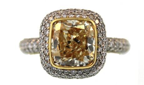 3.01 carat fancy yellow Si1 cushion cut diamond in platinum