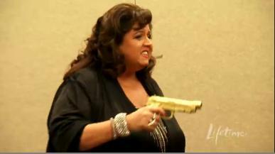 Dance Moms: Locked And Loaded. It’s Target Practice Time At The Abby Lee Dance Company, And There’s A Big Target On Jill’s Back. Bullets & Ballet.