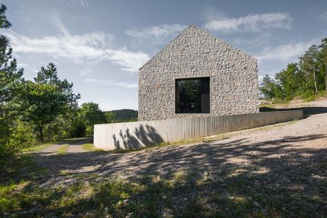 Stone house limestone and concrete exterior in Karst