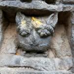 God is also in the cat - a relief above the entrance