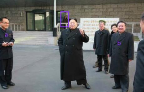 Kim Jong Un outside the Kumkop General Foodstuff Factory for athletes. Also in attendance are WPK Organization Guidance Department deputy director Jo Yong Won (a) and WPK Secretary for Workers' and Social Organizations Choe Ryong Hae (b). In the background of the photo, annotated, is a member of Kim Jong Un's personal security escort (bodyguards) (Photo: Rodong Sinmun/KCNA).