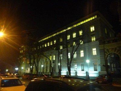 Backpacking in Ukraine: Getting A Free Night Tour of Kiev Nighttime outside the National Bank of the Ukraine, tower at the end.