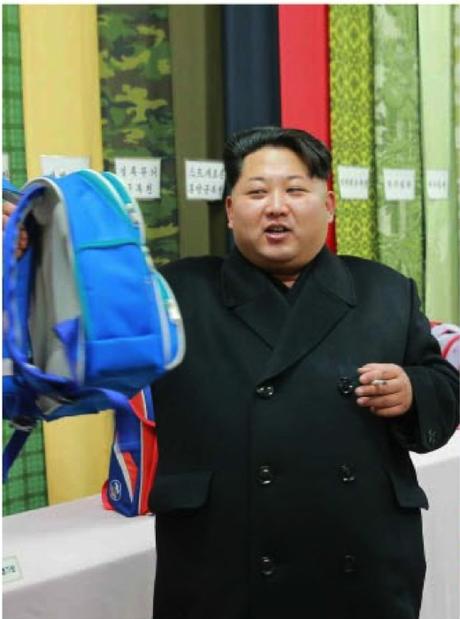 Kim Jong Un examines a backpack manufactured at the Kim Jong Suk Textile Mill (Photo: KCNA/Rodong Sinmun).