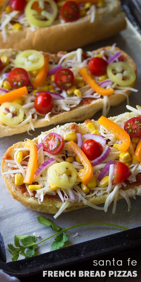 Santa Fe French Bread Pizza, topped with salsa, corn, chiles, peppers, tomatoes and cheese!  Ready in under 30 minutes!