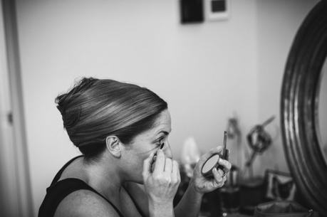 Bride preparing with eyeliner