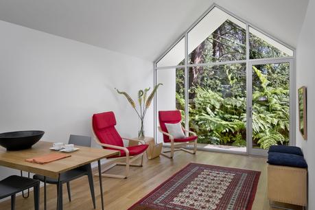 Red POÄNG chairs from IKEA in Berkeley cottage by Turnbull Griffin Haesloop.