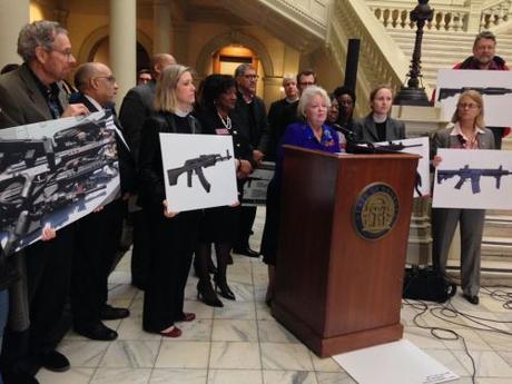 Gun grabber Mary Margaret Oliver at the podium.